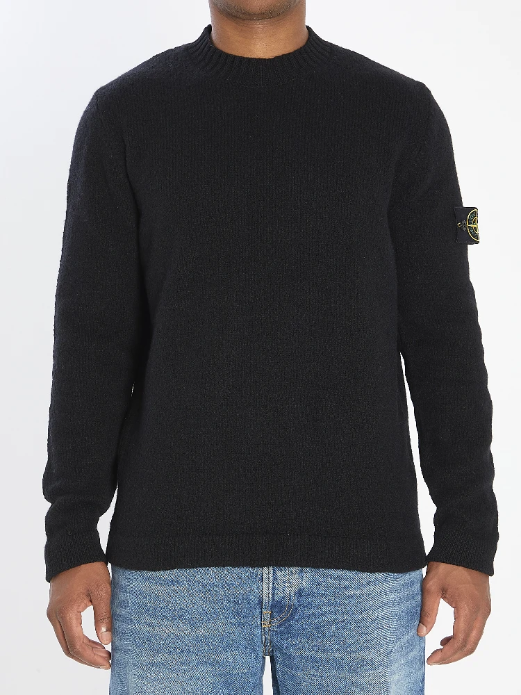 Crew neck sweater with brushed texture.