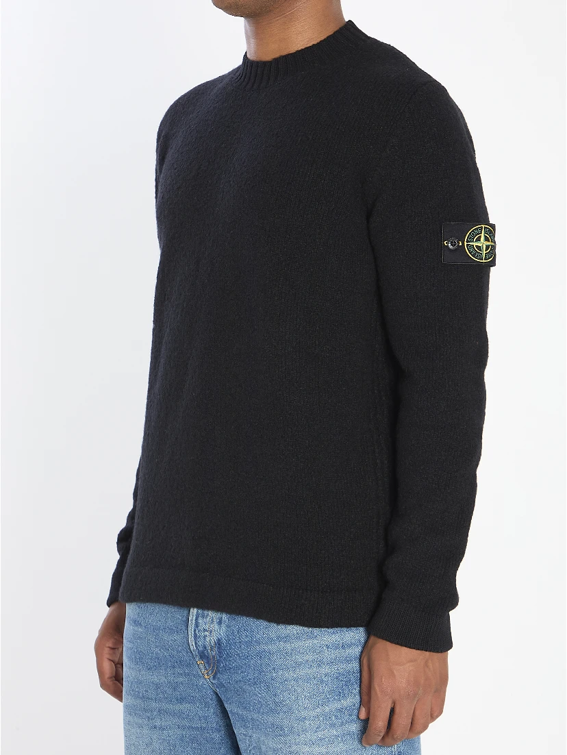 Crew neck sweater with brushed texture.