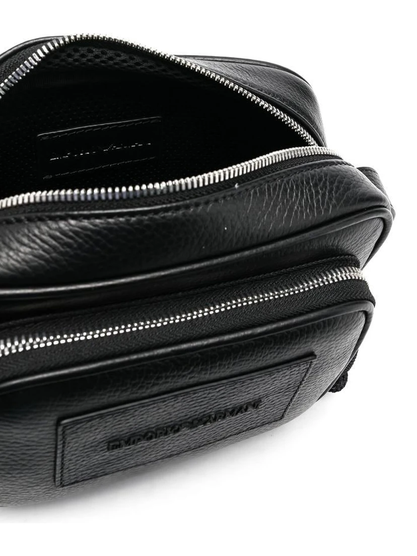 Adjustable leather crossbody bag with zip pockets