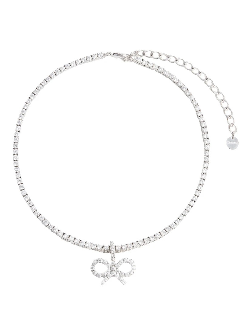 Metallic Tennis Necklace with Bow Charm and Crystal Embellishments in Brass Woman